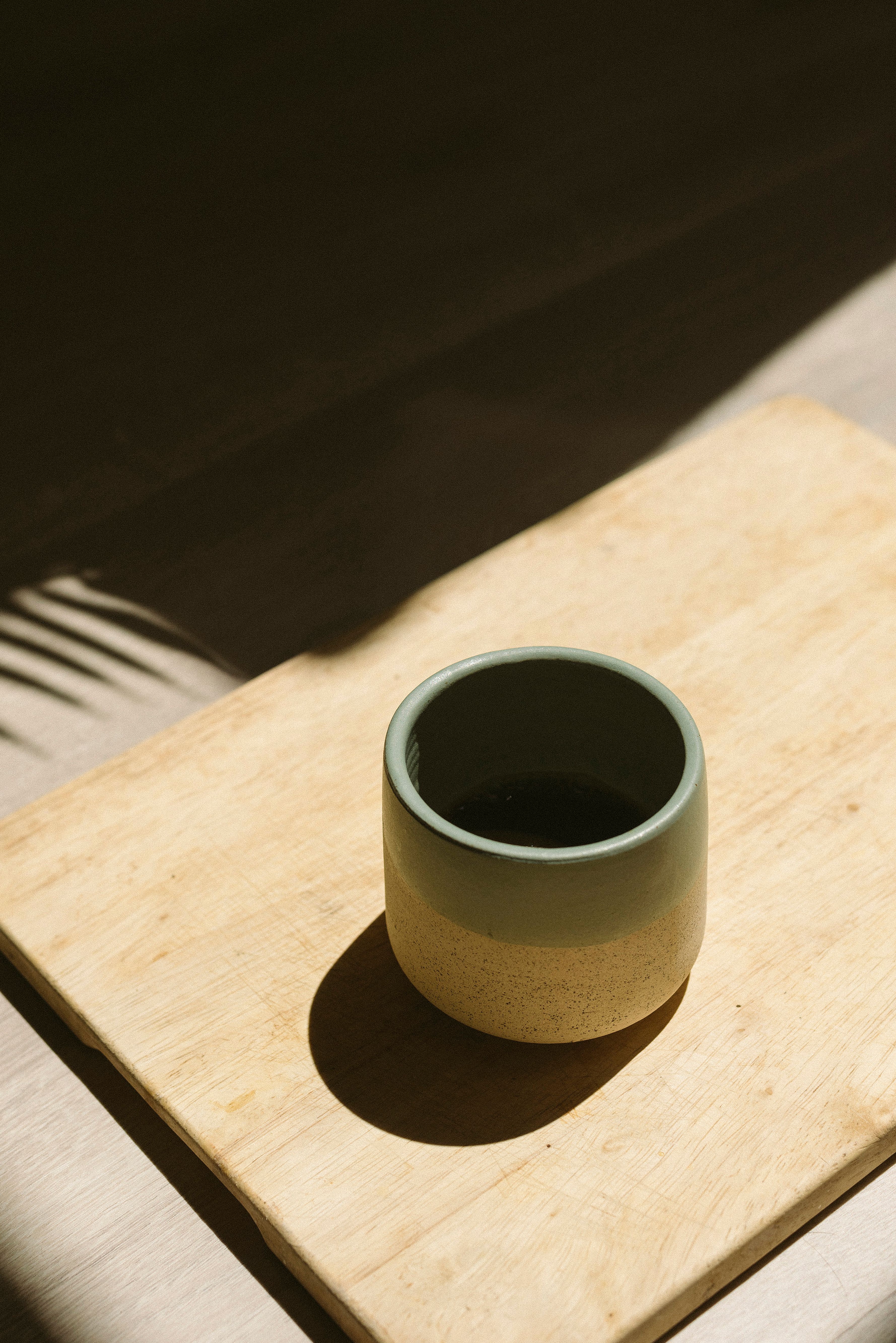 Ash glaze mugs from Batch 07, fresh out of the kiln
